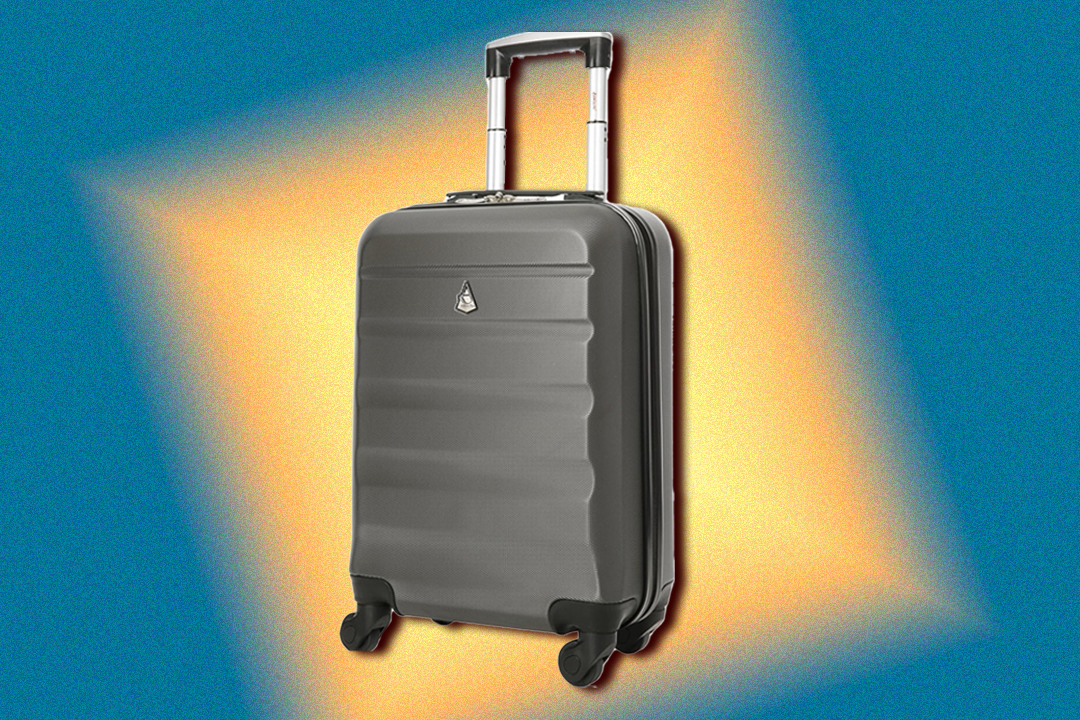 The suitcase features a padlock and four 360-degree spinner wheels