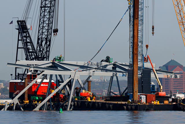<p>Salvage work continues on the collapsed Francis Scott Key Bridge on Monday, 15 April 2024, in Baltimore. The FBI confirmed that agents were aboard the Dali conducting court-authorised law enforcement activity. (AP Photo/Julia Nikhinson)</p>