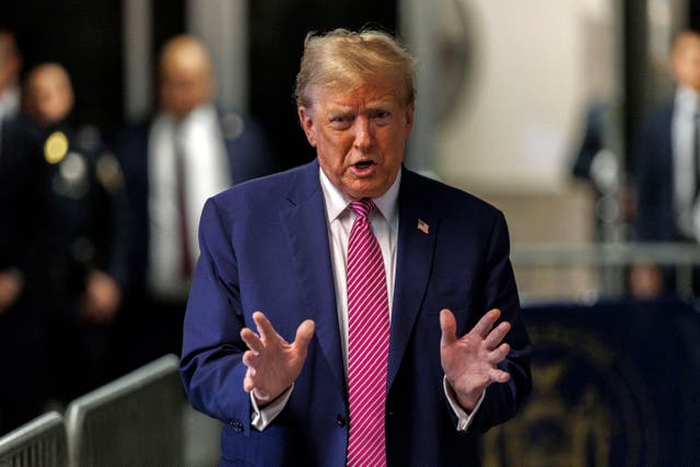<p>Former president Donald Trump speaks to the media outside his trial on Friday 19 April</p>