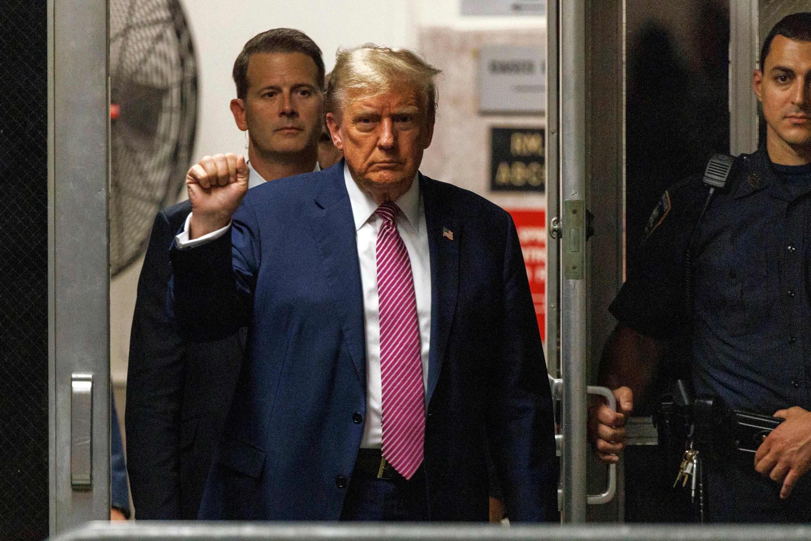 Former President Donald Trump gestures as he returns to the courtroom following a break in his trial on Friday 19 April