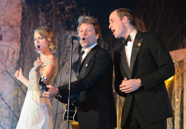 <p>Taylor Swift, Jon Bon Jovi and Prince William on stage at Kensington Palace in London in 2013</p>