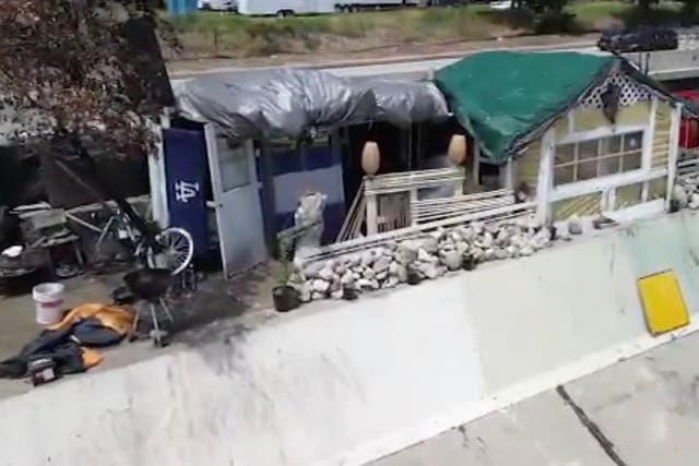 <p>Part of a homeless encampment in Los Angeles includes a home with a front door and electricity. Officials say it poses safety concerns given its close proximity to the  Arroyo Seco river</p>