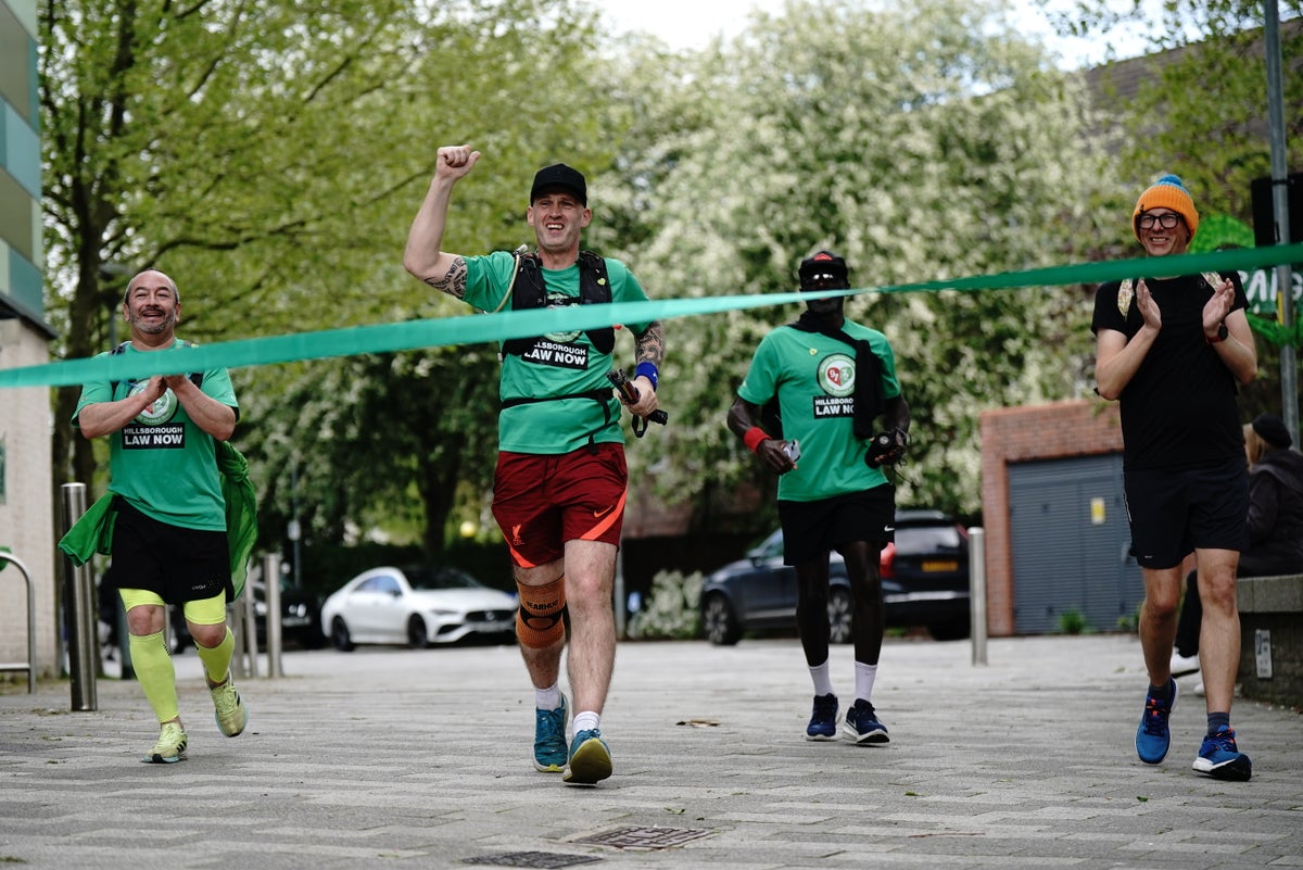 Runner reaches Grenfell Tower after 220-mile challenge to help disaster victims