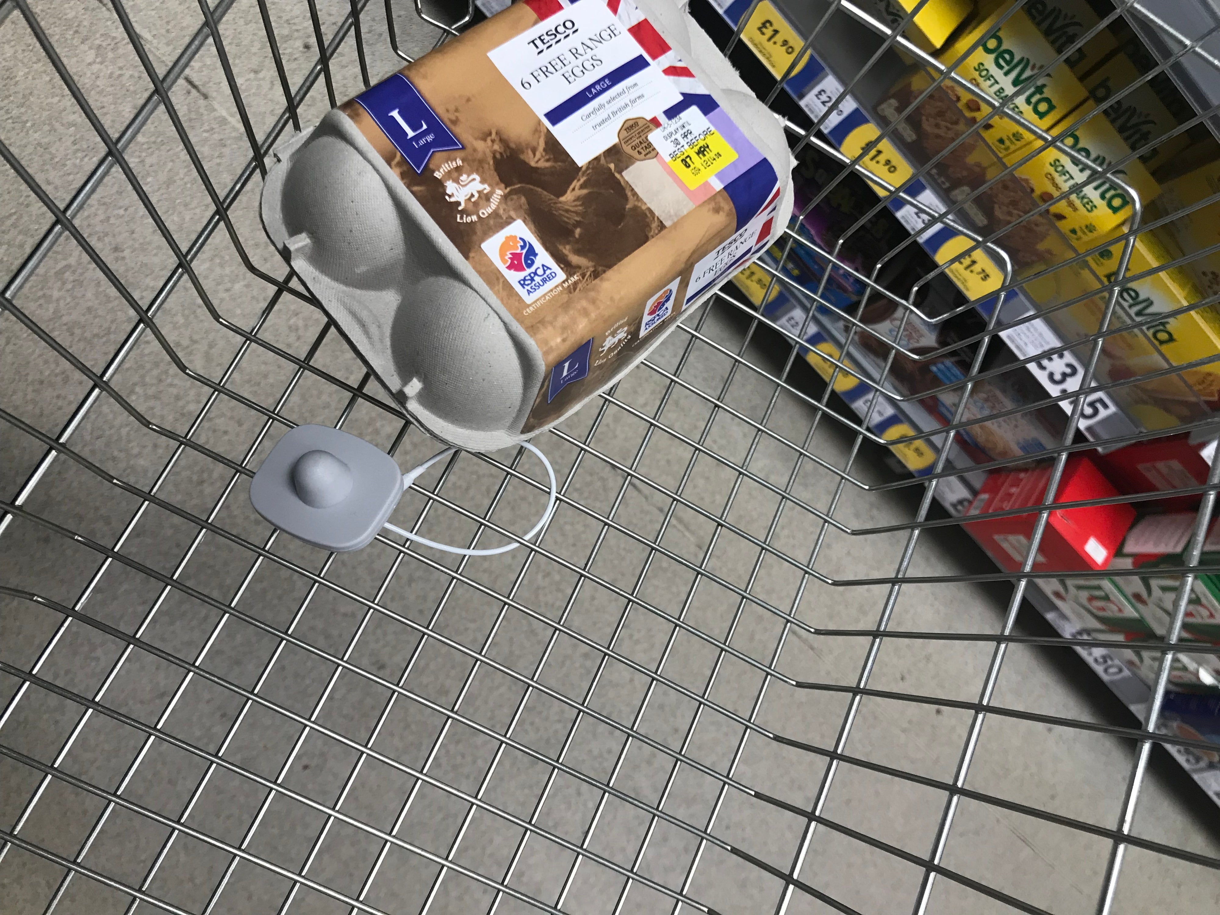 Security tags attached to the bottom of a shopping baskets in Theydon Bois.