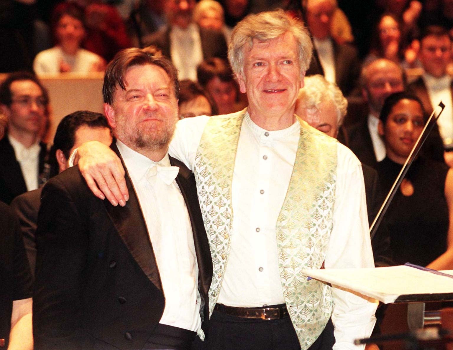 Composer Anthony Payne (right) and his conductor Sir Andrew Davis enjoy the audience’s applause after the first public performance of Elgar’s unfinished Third Symphony at the Royal Festival Hall in London, February 1998