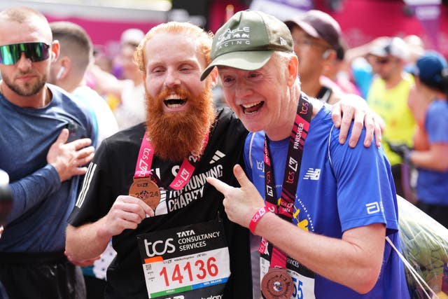 Russ Cook with Chris Evans after finishing the London Marathon (John Walton/PA)