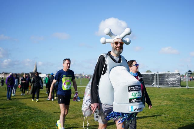 Marcus Mumford ran the fastest marathon while dressed as a tap (Zac Goodwin/PA)