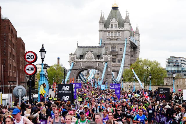 <p>Runners cross Tower Bridge during the TCS London Marathon (Aaron Chown/PA)</p>