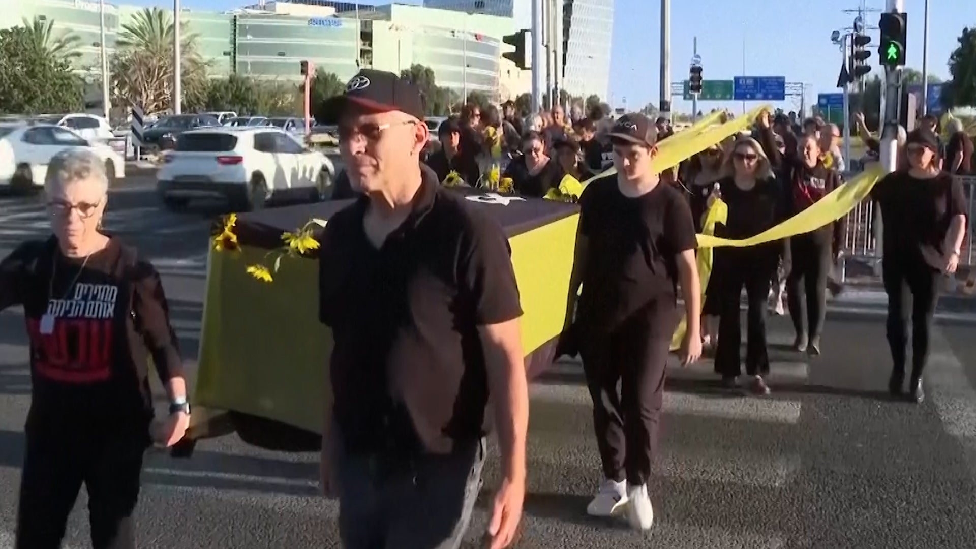 <p>Israeli protesters carry mock coffins in call for release of Gaza hostages (Ami Bentov/AP)</p>