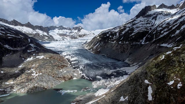 <p>A lake of meltwater has formed on the tongue of the Rhone Glacier near Goms, Switzerland, in June, 2023</p>