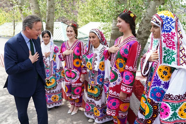 <p>Foreign Secretary Lord David Cameron, meets local women at the Nurek Hydro-Electric Project, as he visits Tajikistan during his five day tour of the Central Asia region</p>