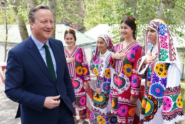 <p>David Cameron, meets local women at the Nurek Hydro-Electric Project, as he visits Tajikistan during his five day tour of the Central Asia region in April 22, 2024</p>