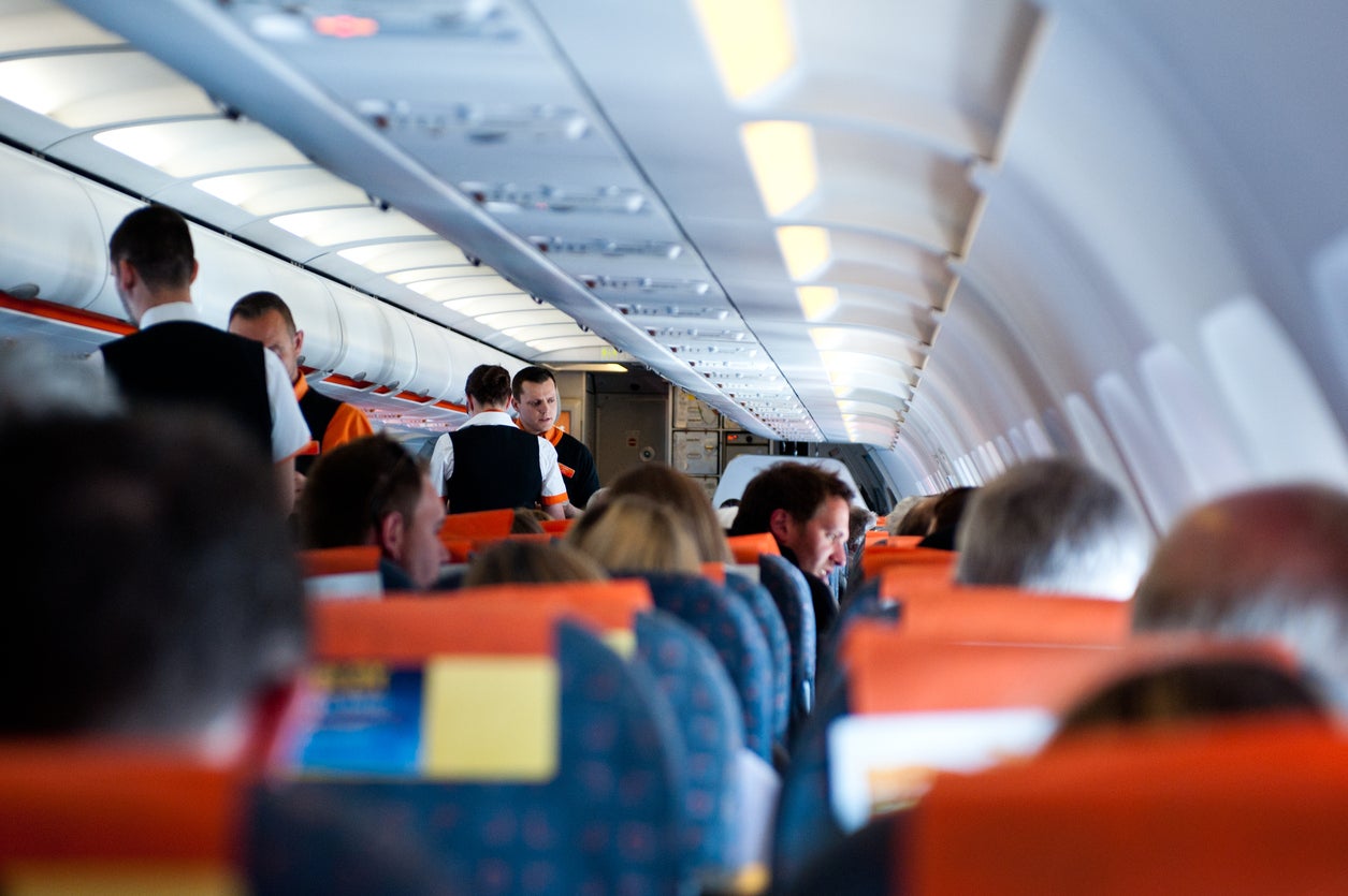 Cabin crew reportedly held the man down for 20 minutes