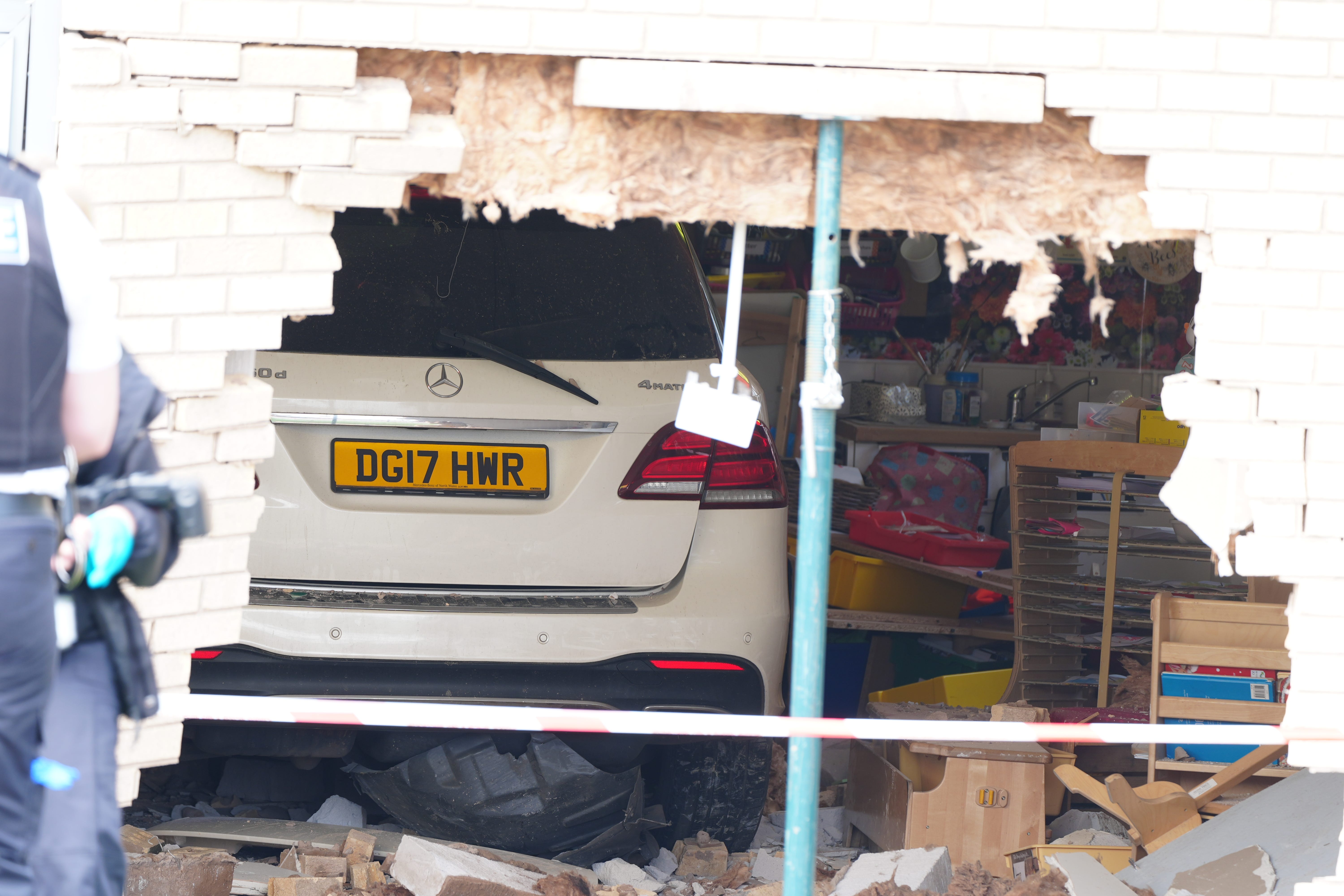Debris and damage to the Beacon Church of England Primary School, in Anfield, Liverpool, after a car crashed into the building (Peter Byrne/PA)