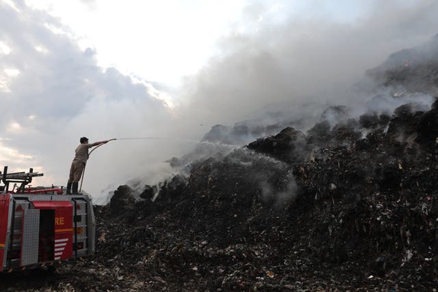 <p>Indian firefighters work to extinguish the fire at the Ghazipur landfill </p>