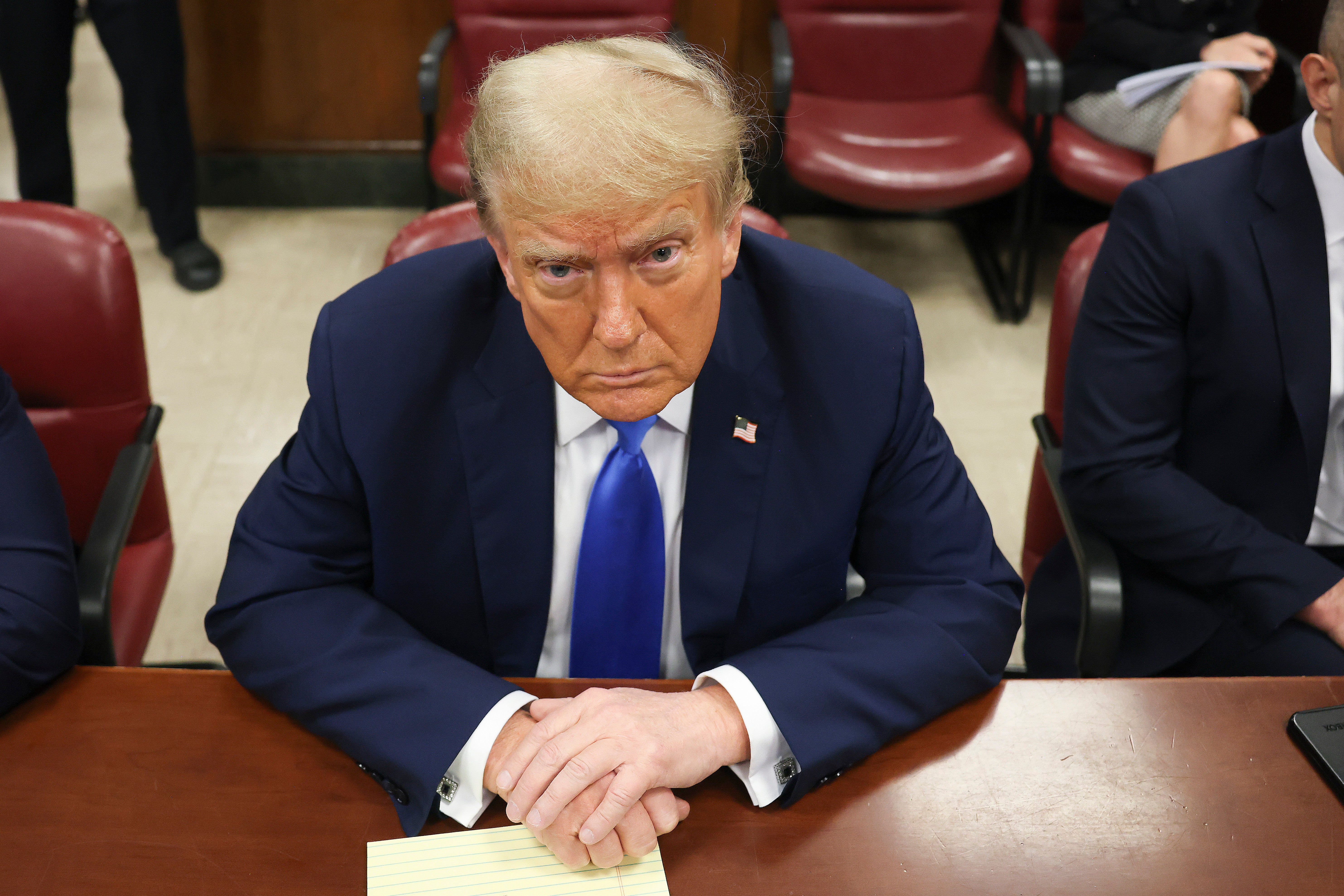 Donald Trump sits at the defence table in a Manhattan criminal courtroom on 22 April