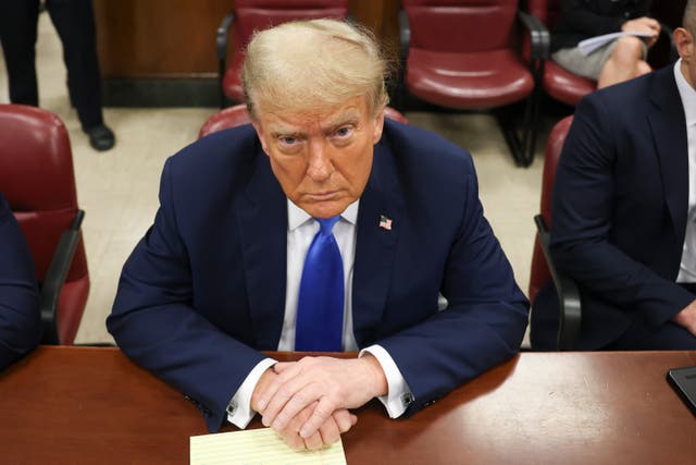 <p>Donald Trump sits at the defence table in a Manhattan criminal courtroom on 22 April – the day that jurors heard opening statements and from the first witness in the case </p>