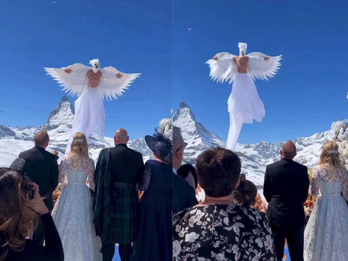 Couple’s elaborate Swiss Alps wedding goes viral for flying ‘bird man’ performer
