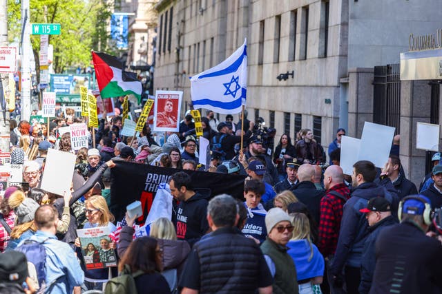 <p>Pro-Palestine and pro-Israel demonstrators protest outside of Columbia University on Monday as tensions rise on the Ivy League campus </p>