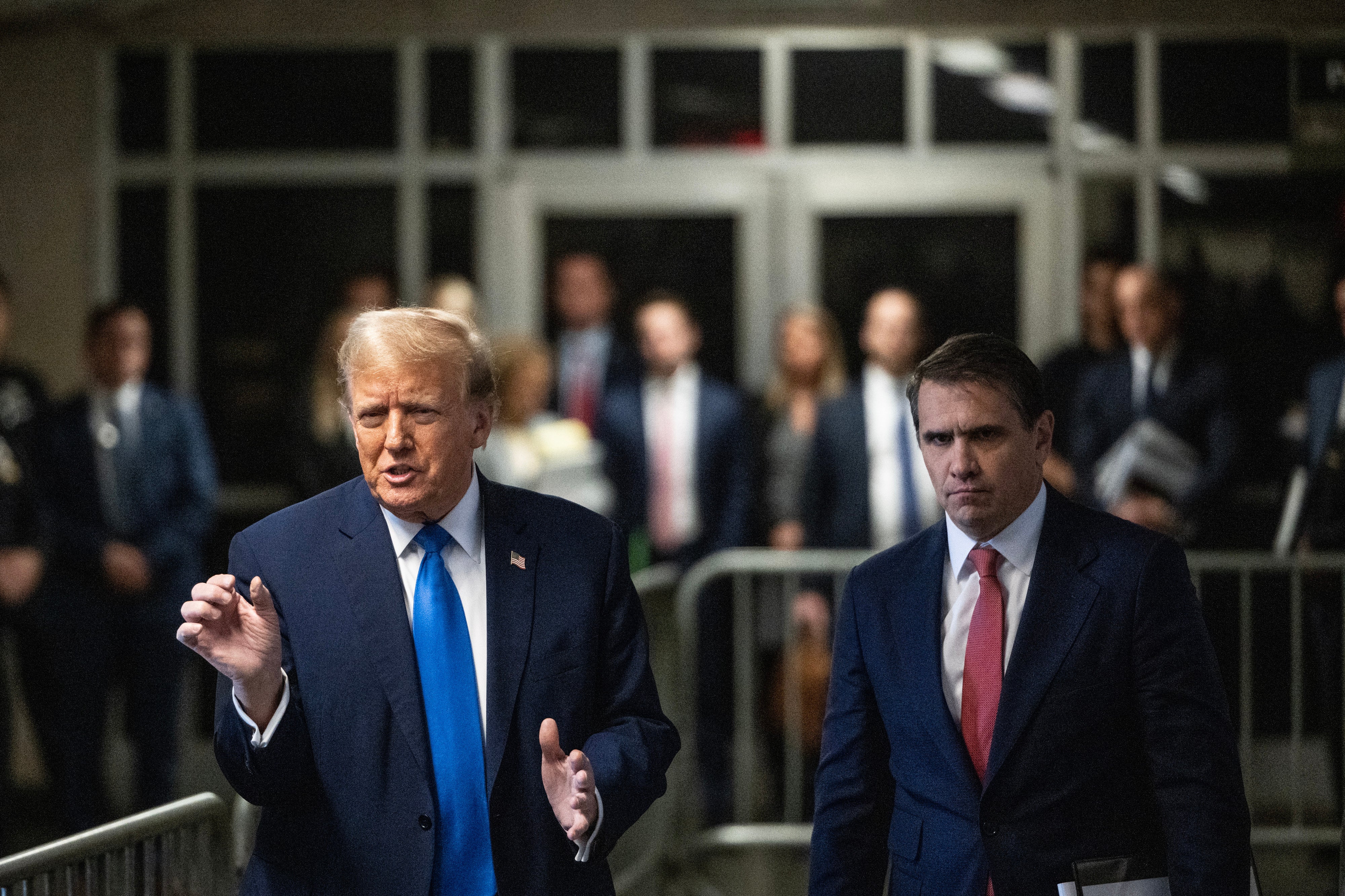 <p>FormerPresident Donald Trump speaks to the media as he leaves court with his attorney Todd Blanche </p>