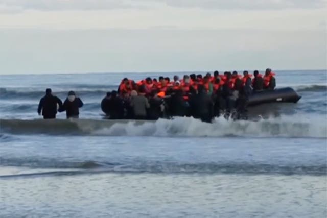 <p>Footage from BBC News shows migrants in a small boat at Dunkirk on Tuesday morning after the French coast guard announced five people had died while trying to cross the Channel in a small dinghy</p>
