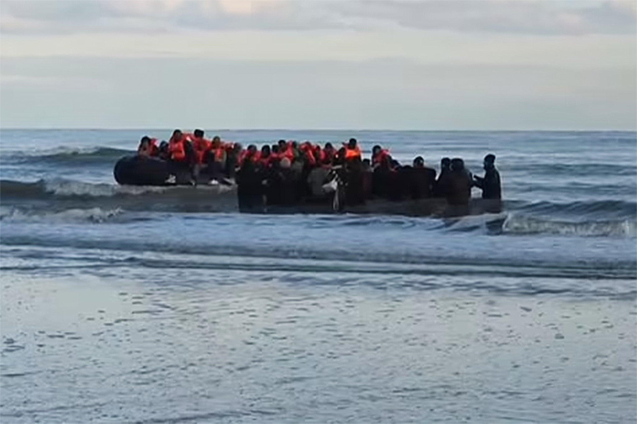 Footage from BBC News shows migrants in small boat at Dunkirk last Tuesday morning after French coast guard announced five people had died