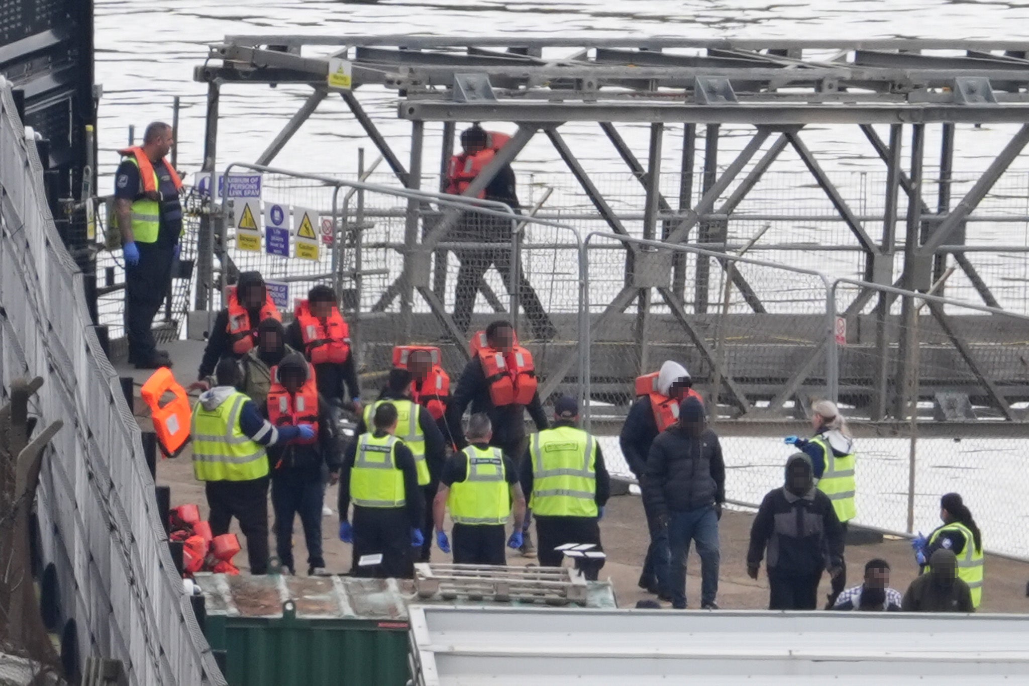 A group of people thought to be migrants are brought in to Dover, Kent