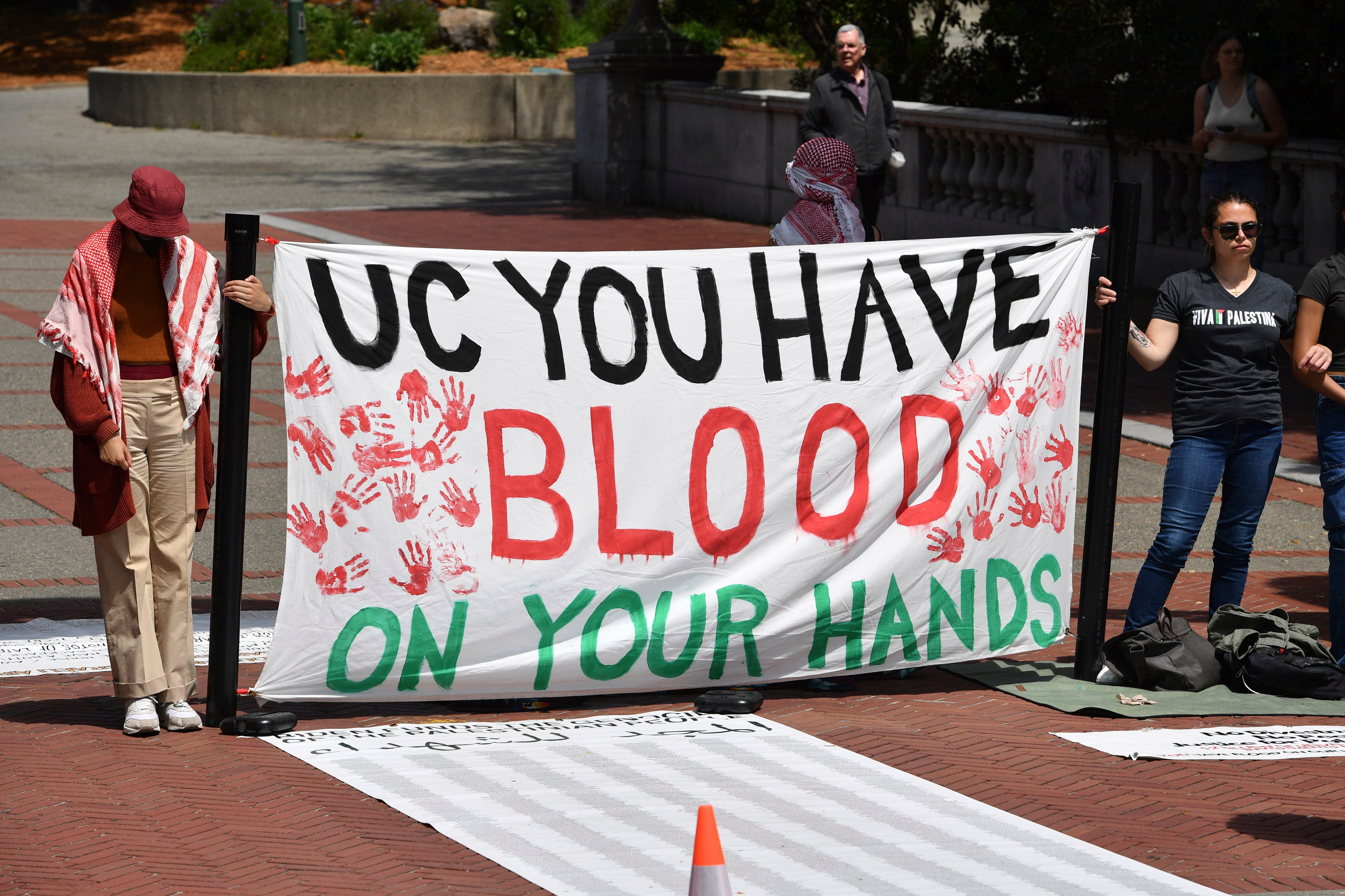 Pro-Palestinian protesters protest in front of Sather Gate during a planned protest on the campus of UC Berkeley in Berkeley, Calif., on Monday, April 22, 2024