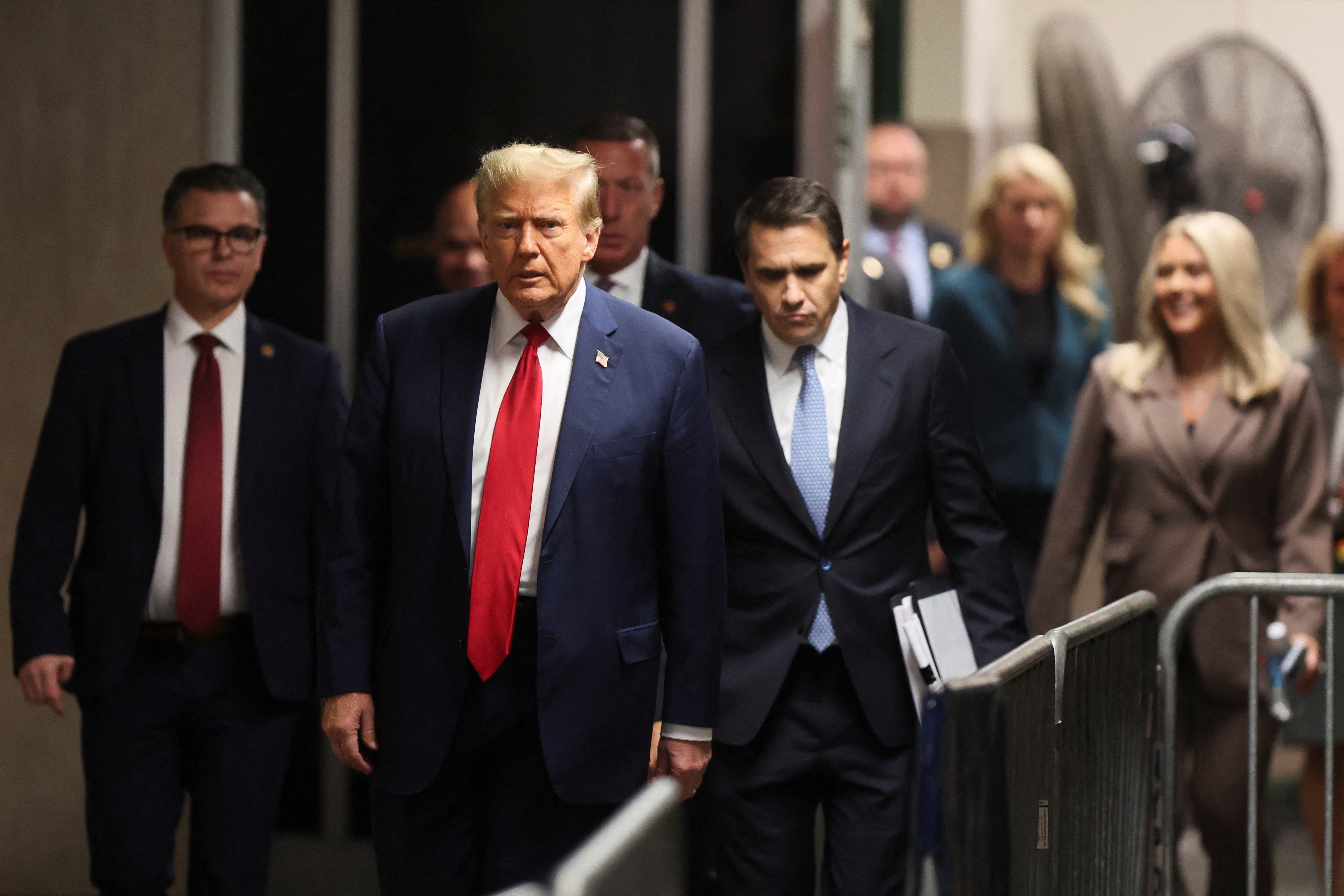 Donald Trump with his attorney Todd Blance (right) in a hallway outside a criminal courtroom in Manhattan on 23 April