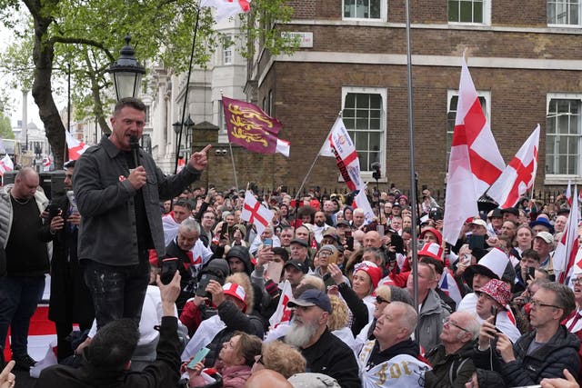 Tommy Robinson speaking during a St George’s Day rally on Whitehall, in Westminster (Jordan Pettitt/PA)