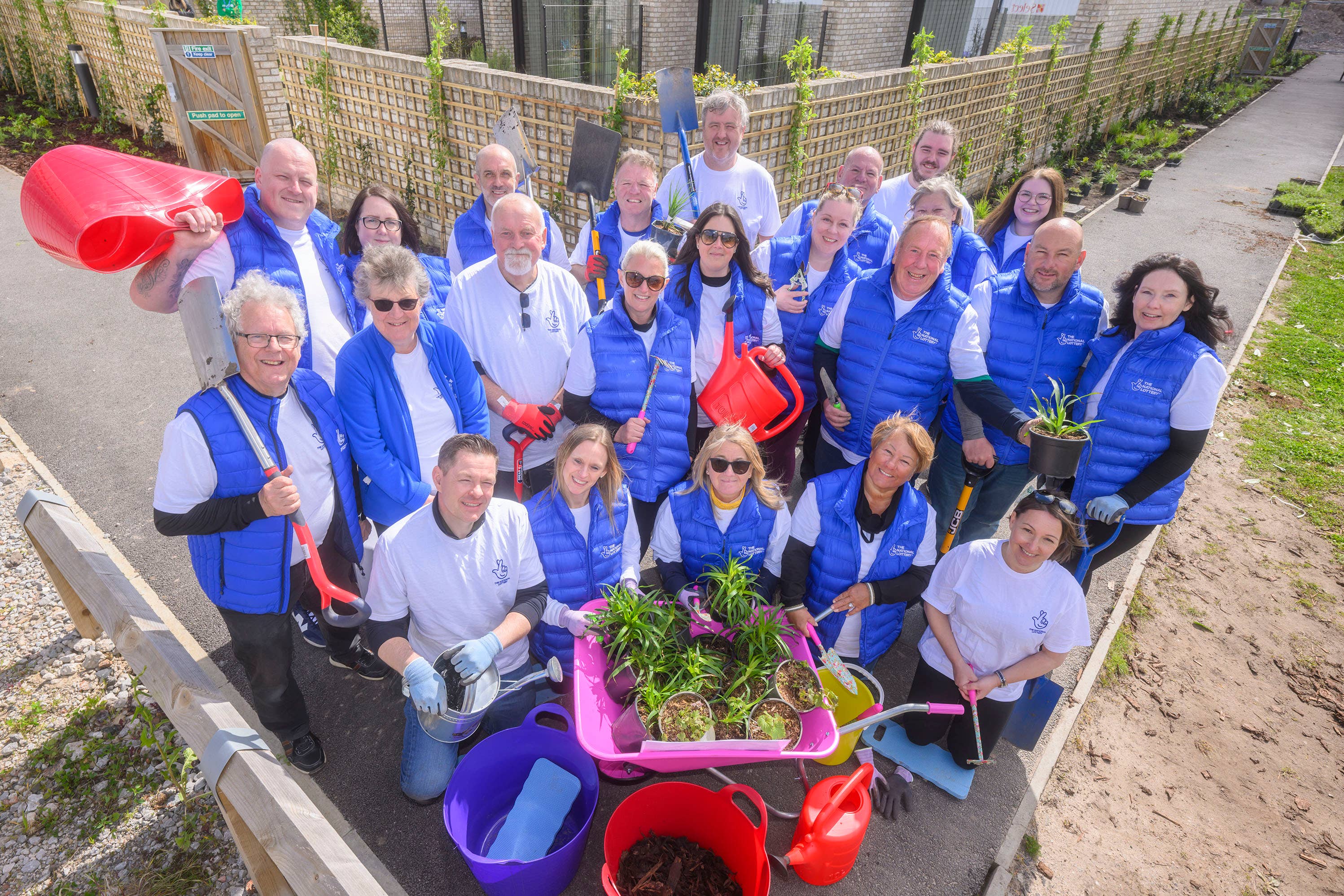 Lottery winners from across the UK help out with gardening at Alder Hey Children’s Hospital (Anthony Devlin/PA)