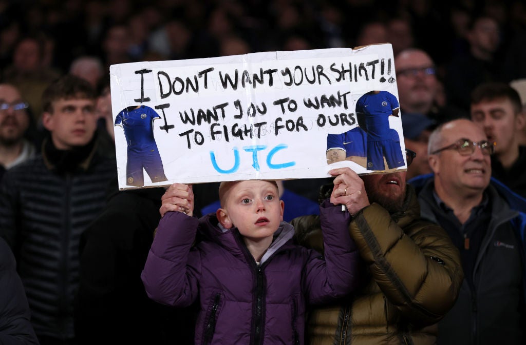 A young Chelsea fan sends a message from the away end