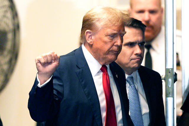 <p>Former President Donald Trump appears outside the courtroom during his trial for allegedly covering up hush money payments at Manhattan Criminal Court on 23 April 2024</p>