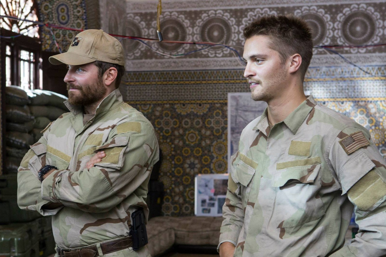 Bradley Cooper (left) and Luke Grimes on the set of ‘American Sniper’