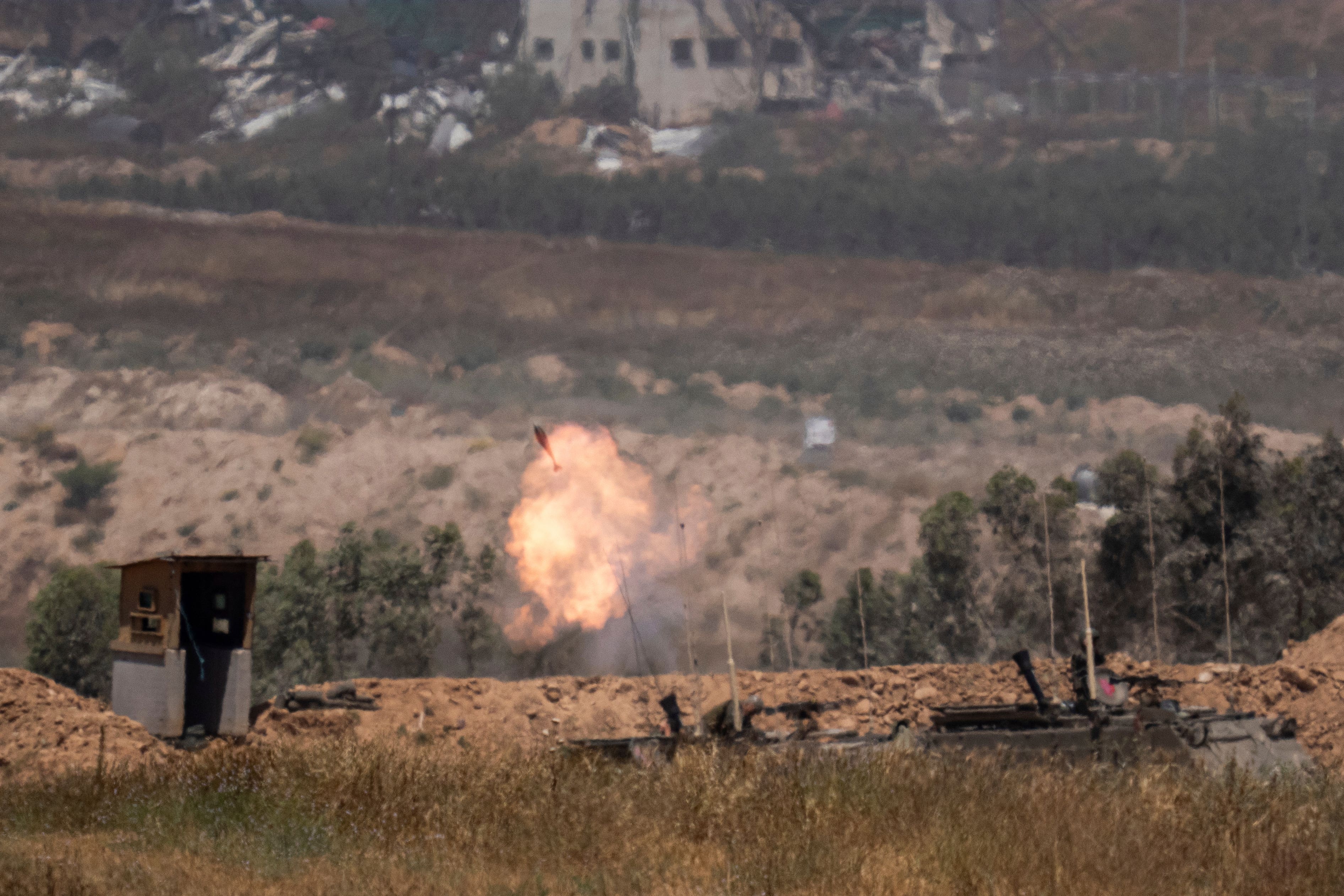 Israeli soldiers fire mortars from southern Israel towards the Gaza Strip (Ohad Zwigenberg/AP)