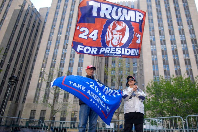 <p>Supporters of former President Donald Trump stand outside Manhattan criminal court building, Monday, 22 April 2024, in New York</p>
