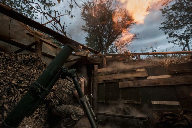 Ukrainian soldiers from the assault brigade inflict fire damage with a 120 mm mortar while supporting the assault operations of the infantry on April 19, 2024 in Ukraine