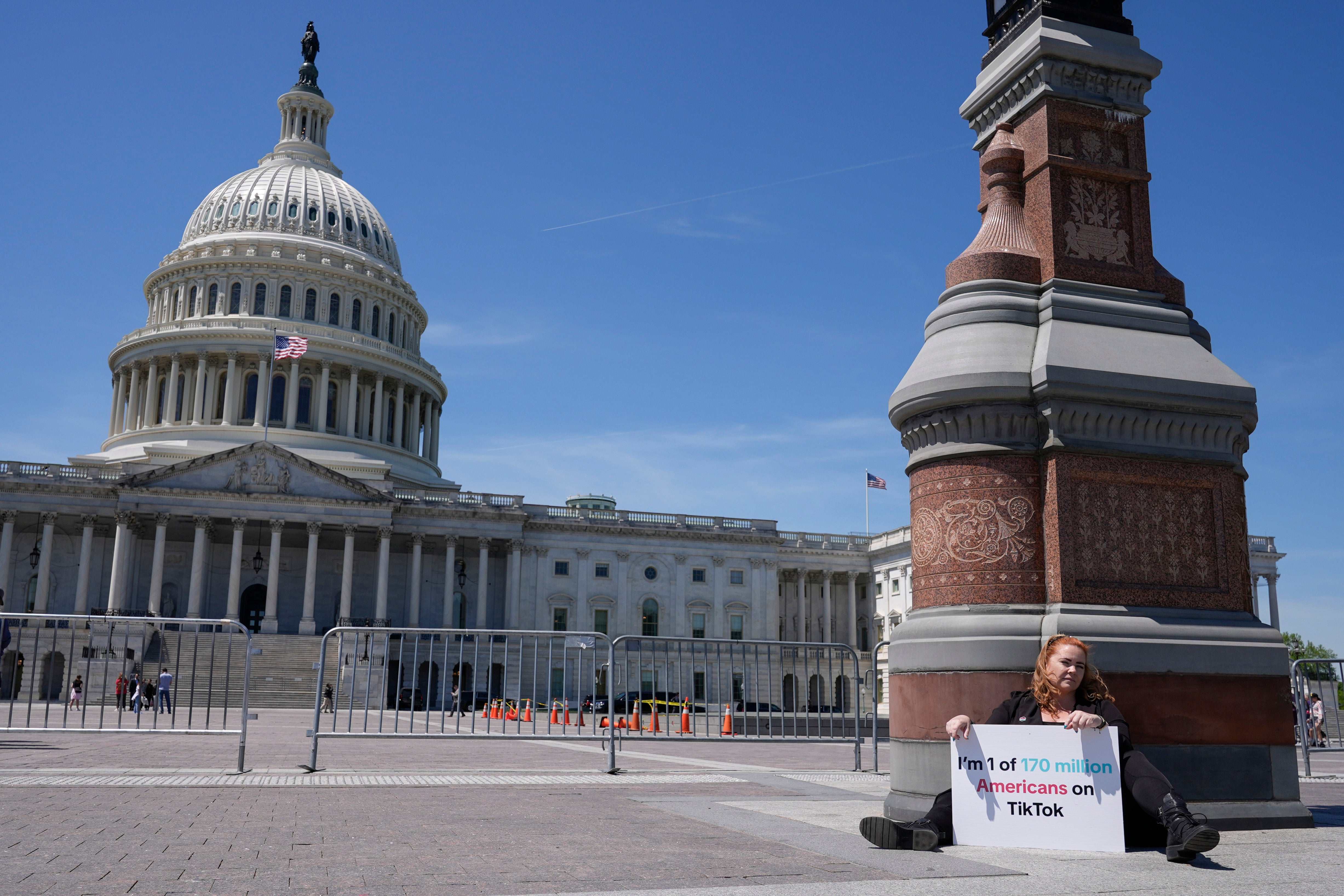 Jennifer Gay, a TikTok content creator, sits outside the US Capitol on 23 April, 2024, in Washington, DC
