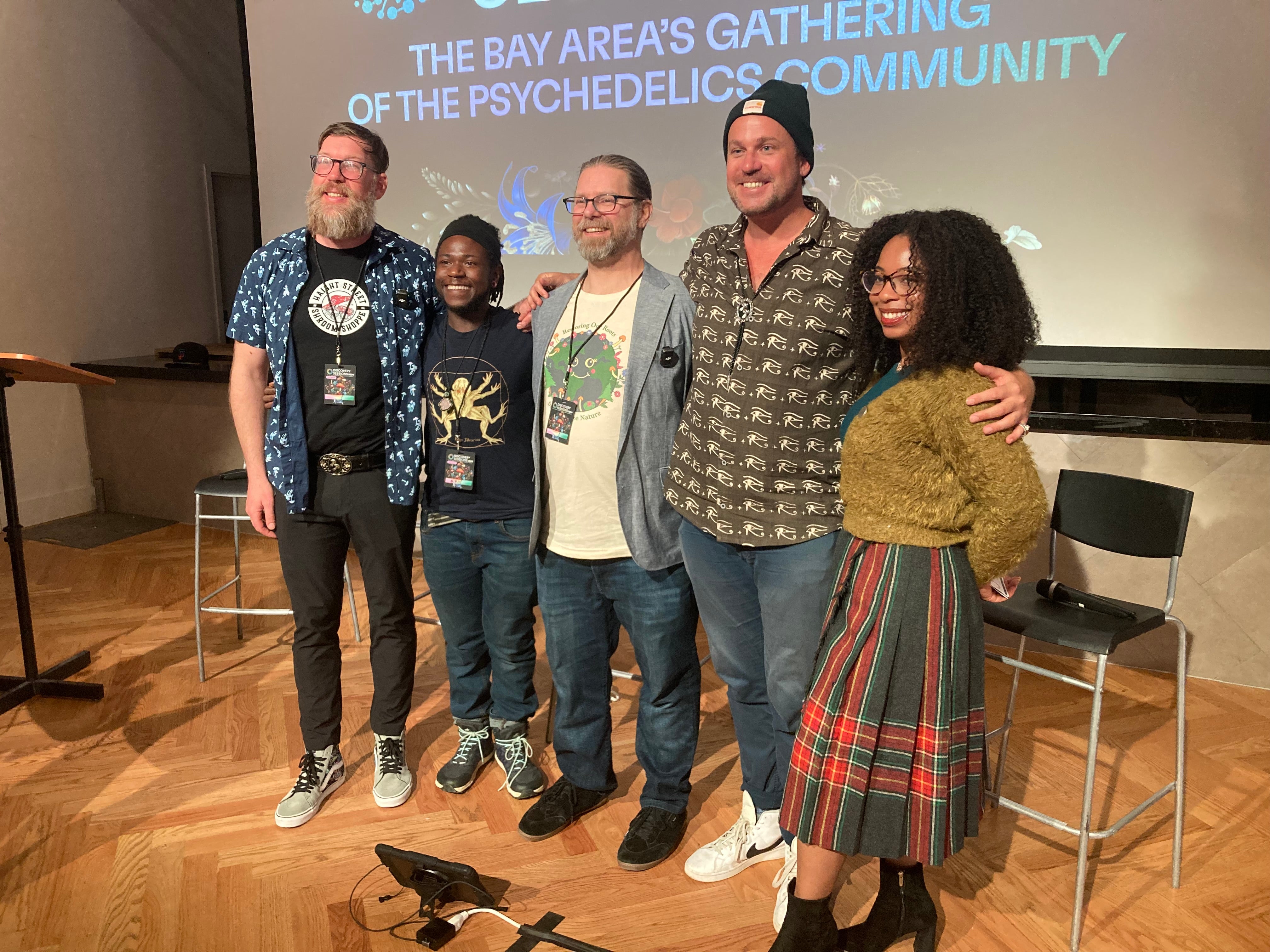 Niko Summers, second from left, Larry Norris, middle, and Dennis Walker, second from right, pose after a panel on psychedelic entrepreneurship