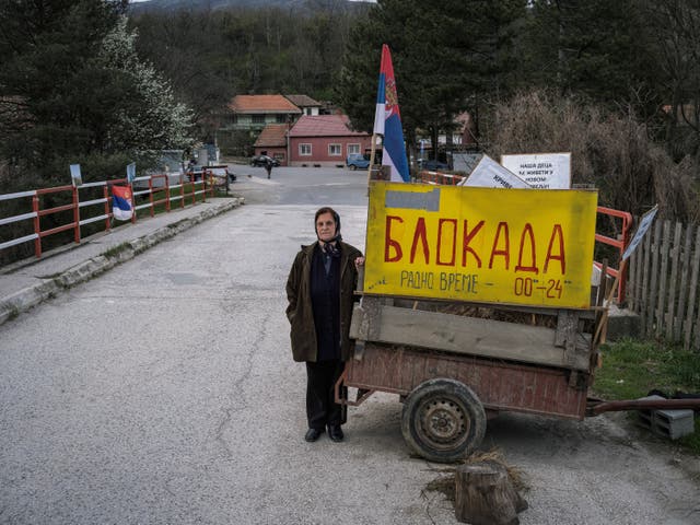 <p>Stana Jorgovanovic, 79, at a barricade in Krivelj, eastern Serbia. ‘I feel so sorry about our beautiful village, I am not sure I will survive the move,’ she says </p>