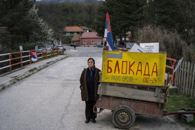 <p>Stana Jorgovanovic, 79, at a barricade in Krivelj, eastern Serbia. ‘I feel so sorry about our beautiful village, I am not sure I will survive the move,’ she says </p>