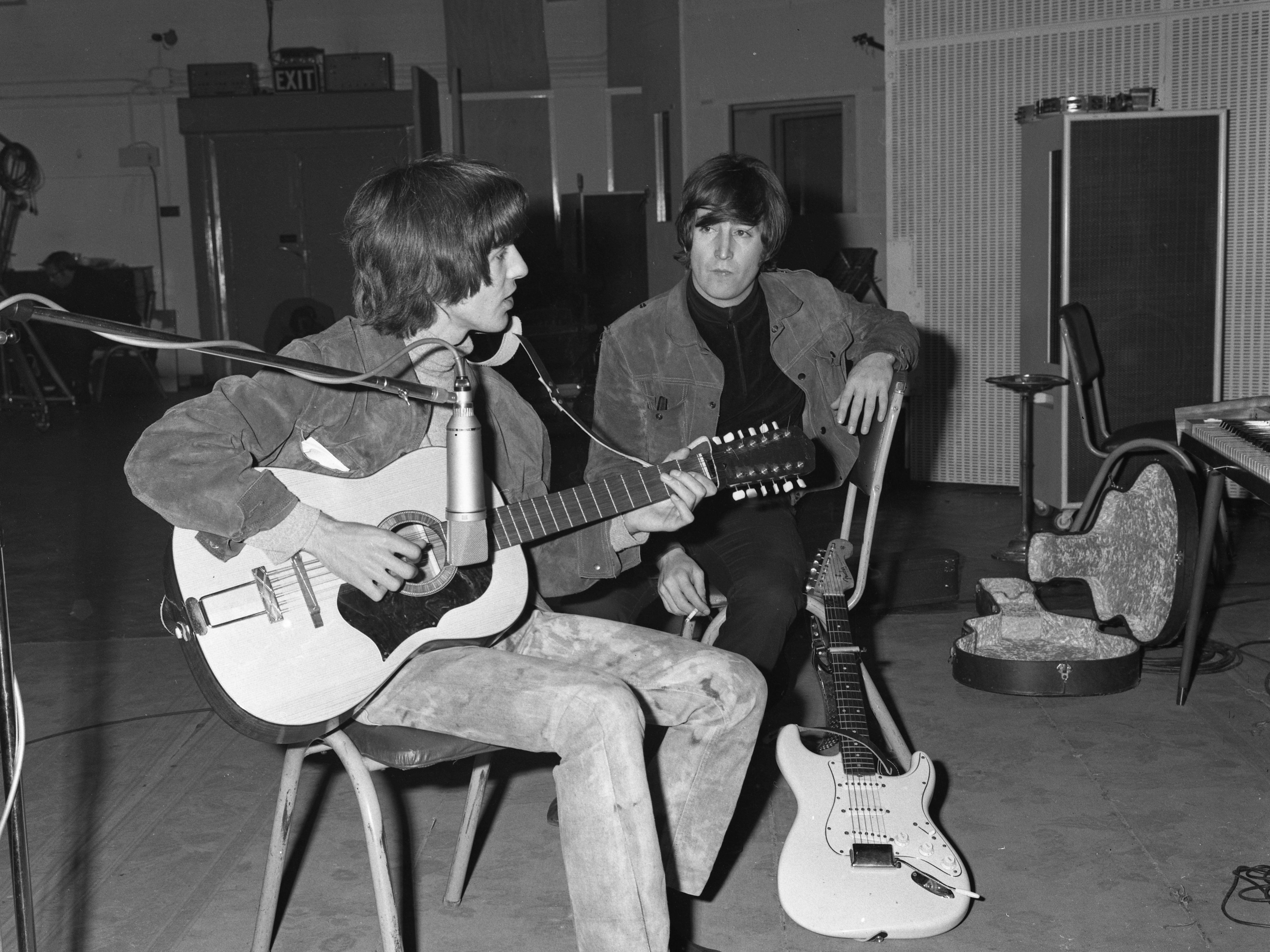 <p>George Harrison playing the Framus acoustic guitar</p>