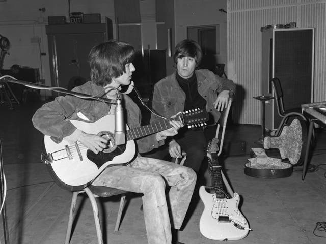 <p>George Harrison playing the Framus acoustic guitar</p>