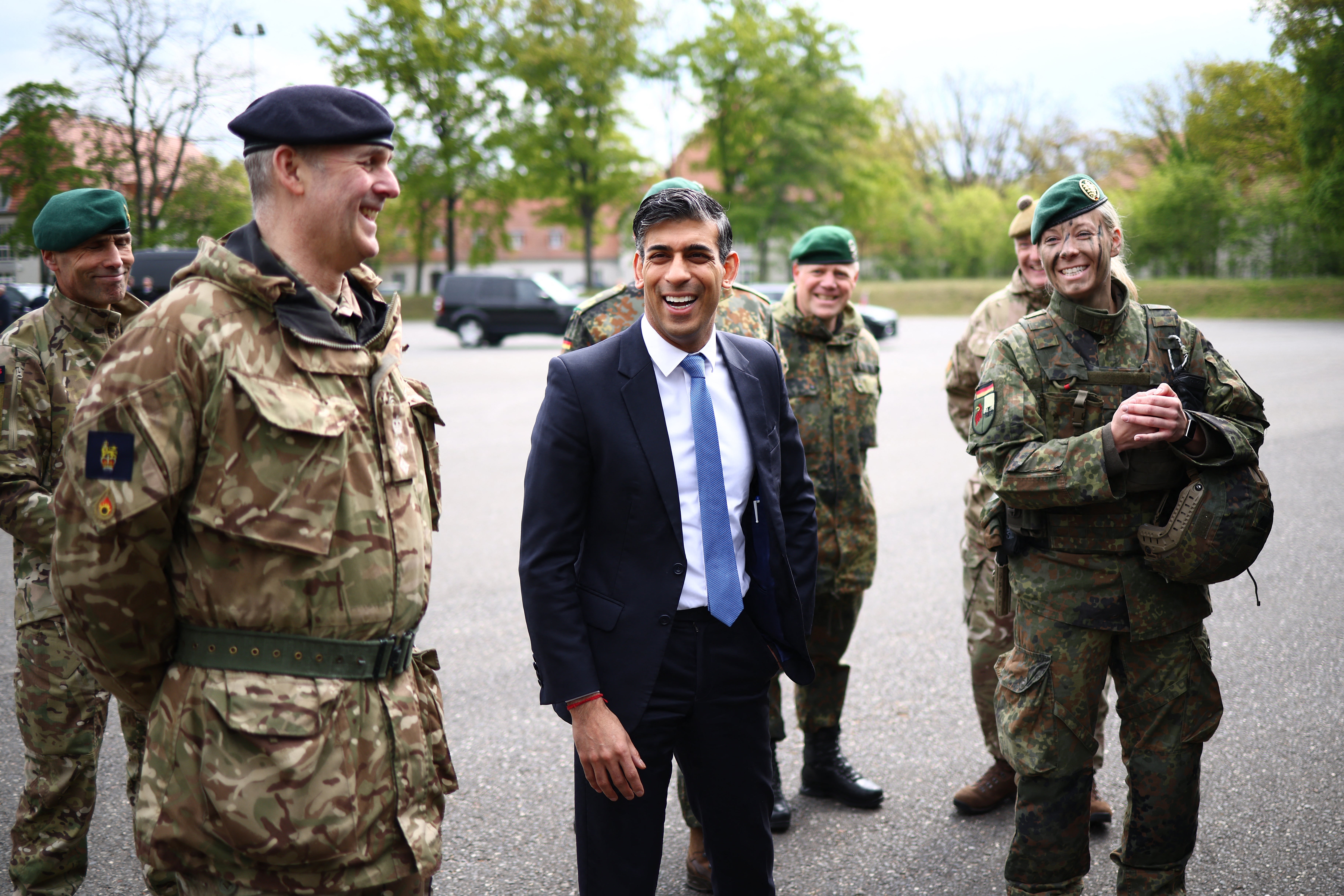 Rishi Sunak speaks with military personnel as he visits the Julius Leber Barracks in Berlin on Wednesday