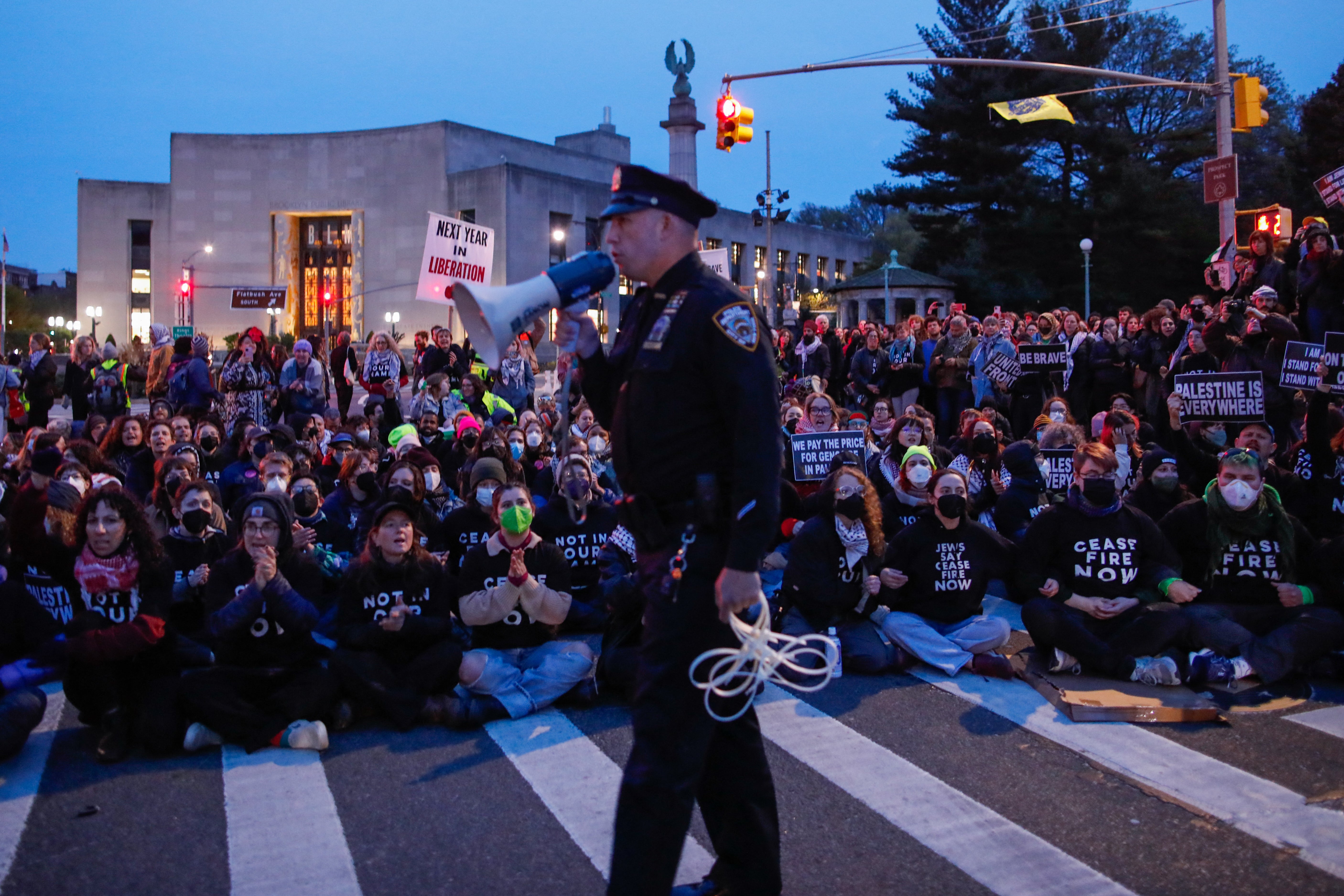 Protesters block the street near the home of Sen Chuck Schumer