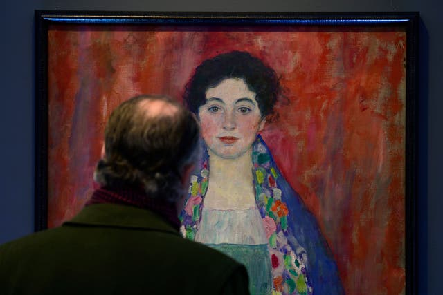 <p>A man looks at painting ‘Portrait of Fräulein Lieser’ by Austrian painter Gustav Klimt prior to an auction, in Vienna, Wednesday, 24 April 2024</p>