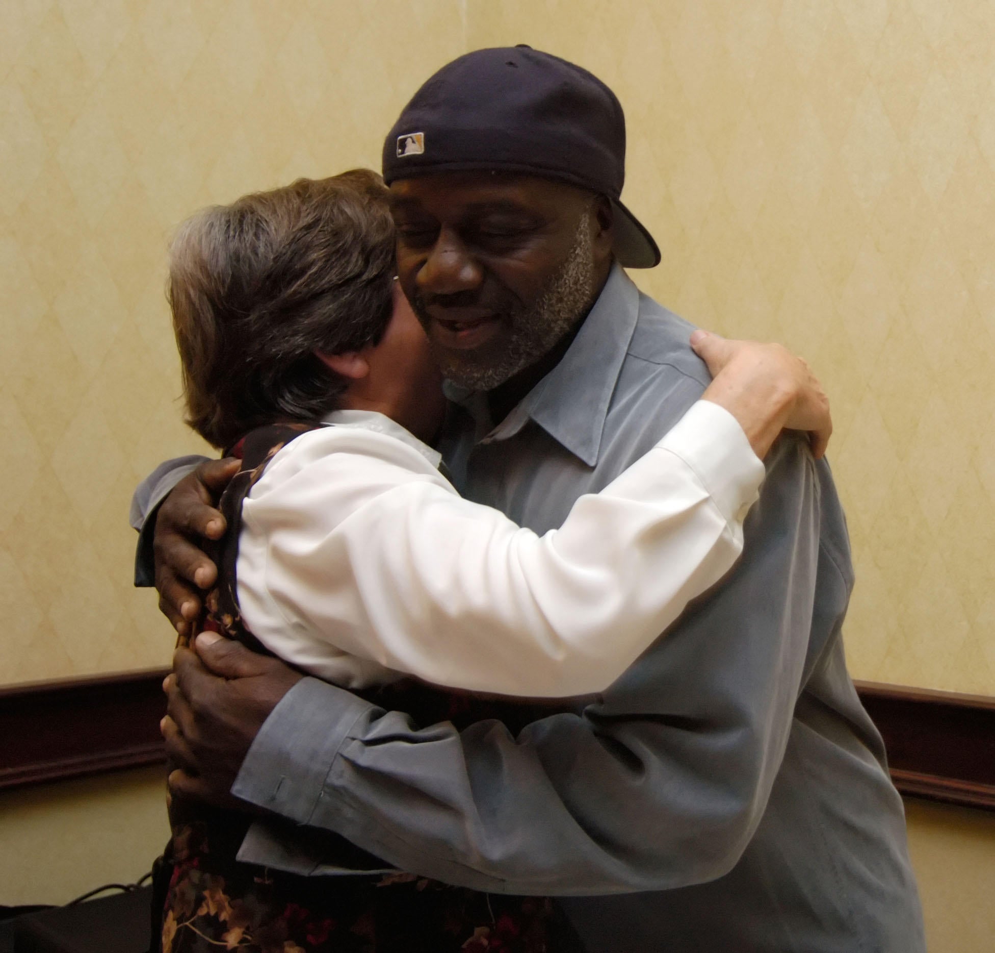 Sister Helen Prejean, author of the book ''Dead Man Walking,'' hugs Shujaa Graham, who spent six years on San Quentin's death row before being exonerated, following an ACLU press conference in San Fransisco, CA., on Sunday, Dec. 11, 2005