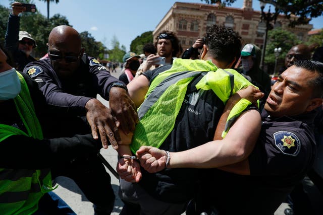 USC Public Safety Officers detain a protester during a Gaza solidarity occupation on campus to advocate for Palestine in Los Angeles, California, USA, 24 April 2024