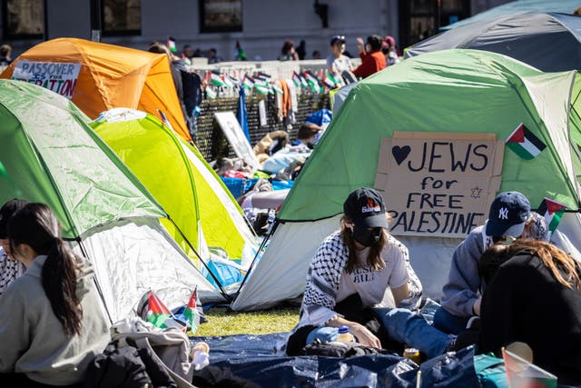<p>Student protesters sit in front of a tent during the Pro-Palestinian protest at the Columbia University campus in New York, Monday April 22, 2024. </p>