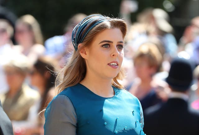 <p>Princess Beatrice arrives at St George's Chapel at Windsor Castle before the wedding of Prince Harry to Meghan Markle on May 19, 2018</p>